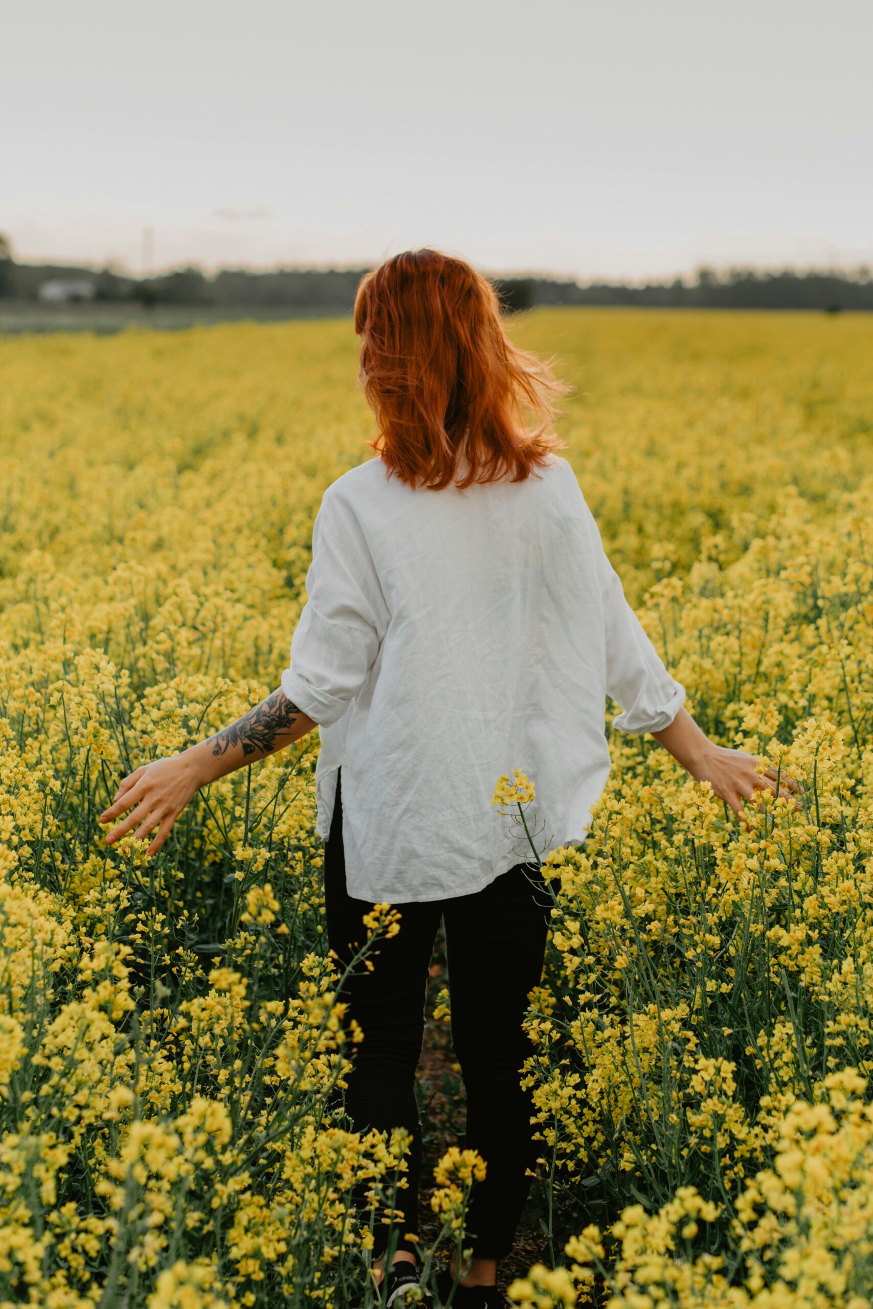 Woman standing in soft morning light symbolizing moving from shame into identity in Christ